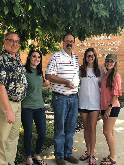 2018 Outstanding Faculty Award winner, Jason Apple, standing with his student mentees Darynne Dahlem and Mersady Redding, and Dr. Charles Rosencrans.  student 