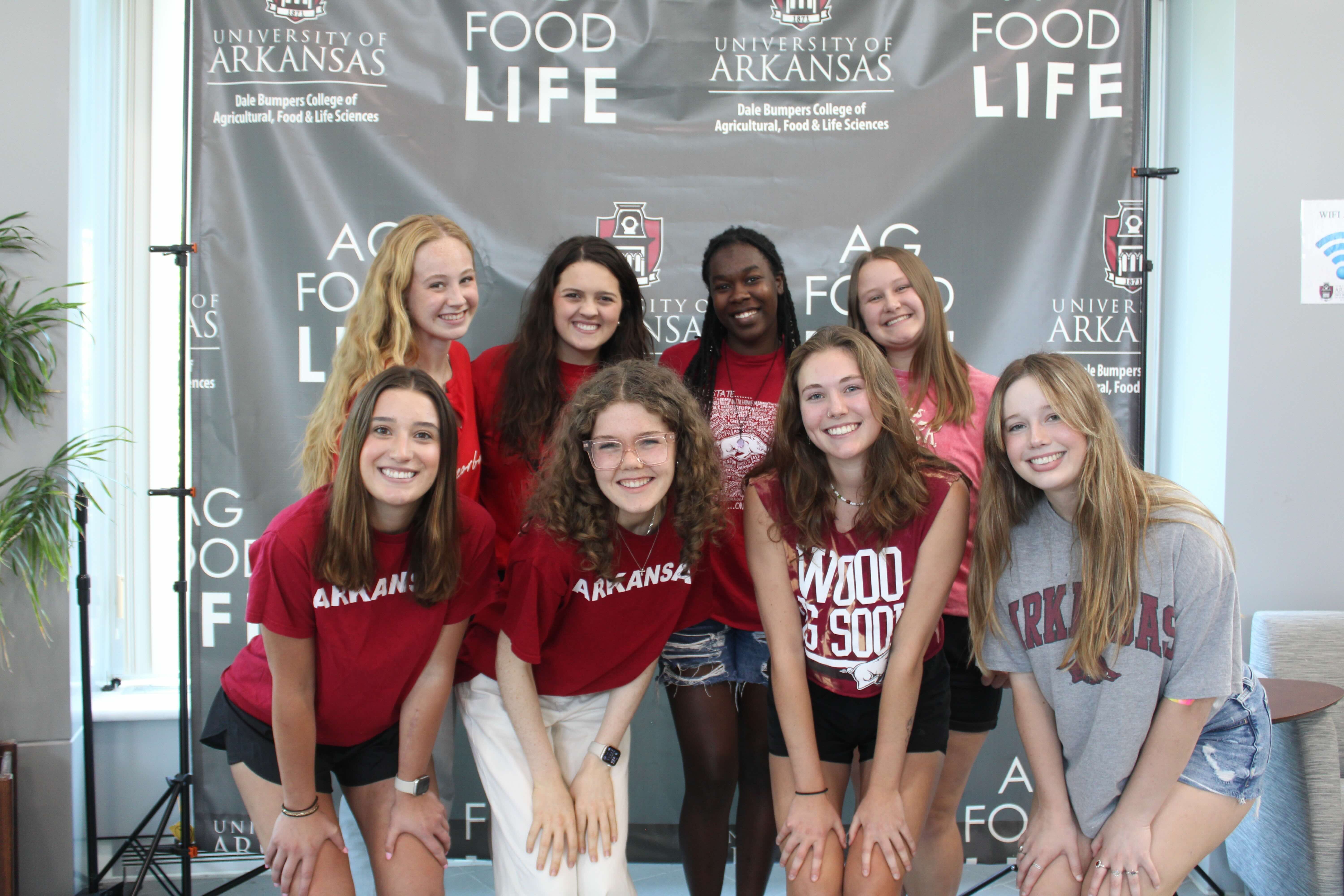 Group photo of the Fall 2024 Honors Student Mentor team, wearing Razorback attire.