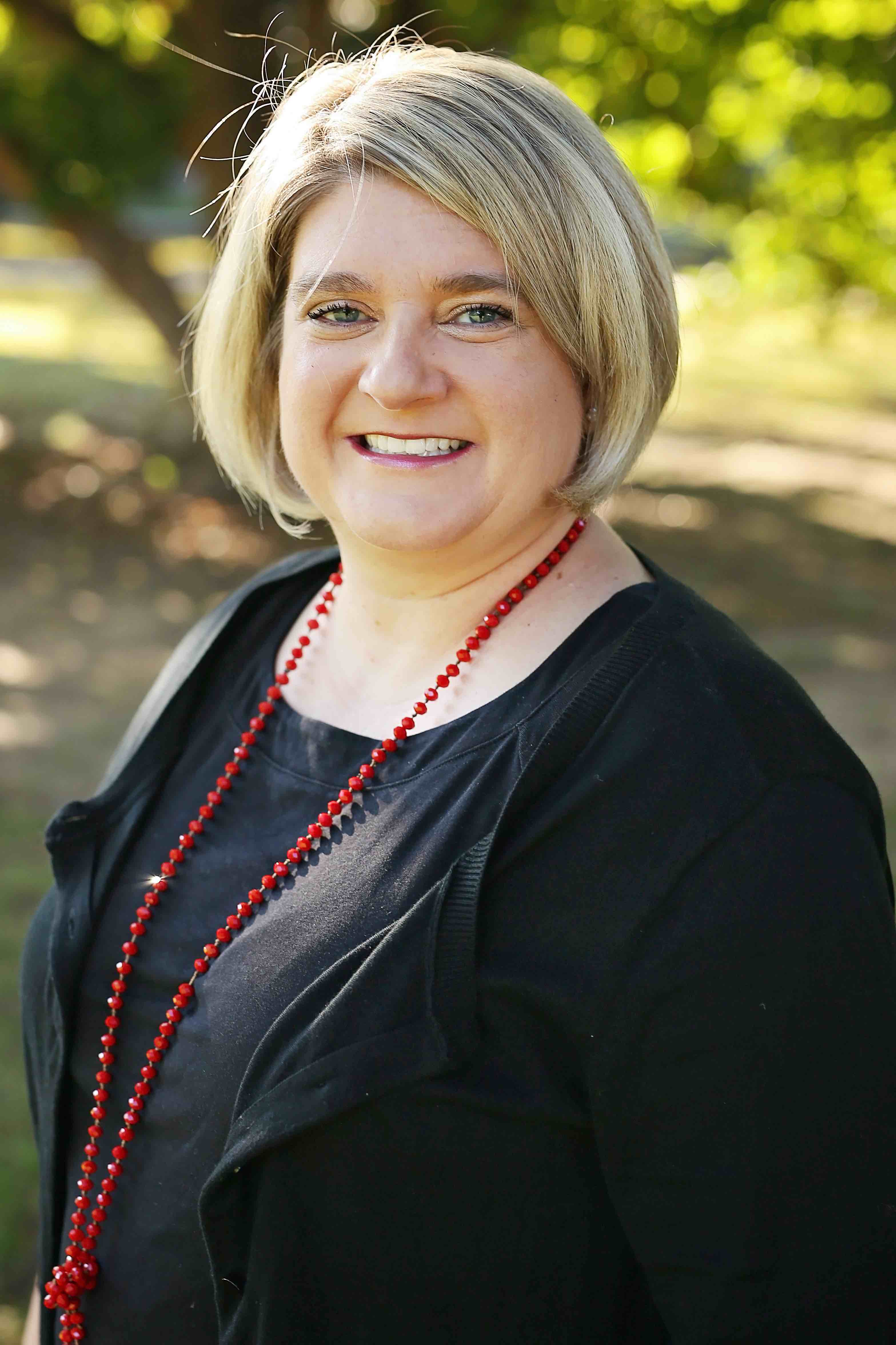 Headshot image of Dr. Jill Rucker looking into the camera smiling